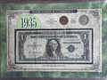 1935 $1 Silver Certificate Series E, 1935 Lincoln Wheat penny, and a 1935 Buffalo nickel.